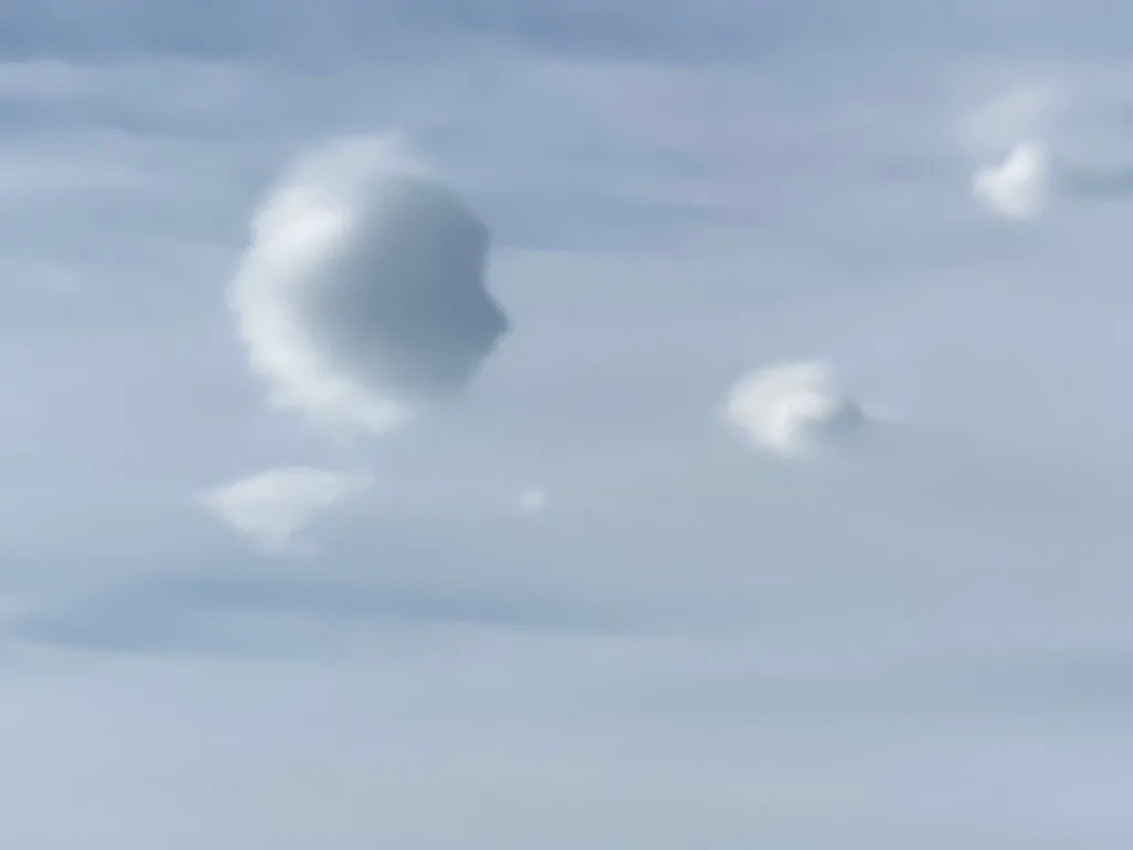 Psychosynthesis Therapy for Anxiety & the Inner Critic Alex Golding Therapy A single soft white cloud drifting in a pale blue sky.
