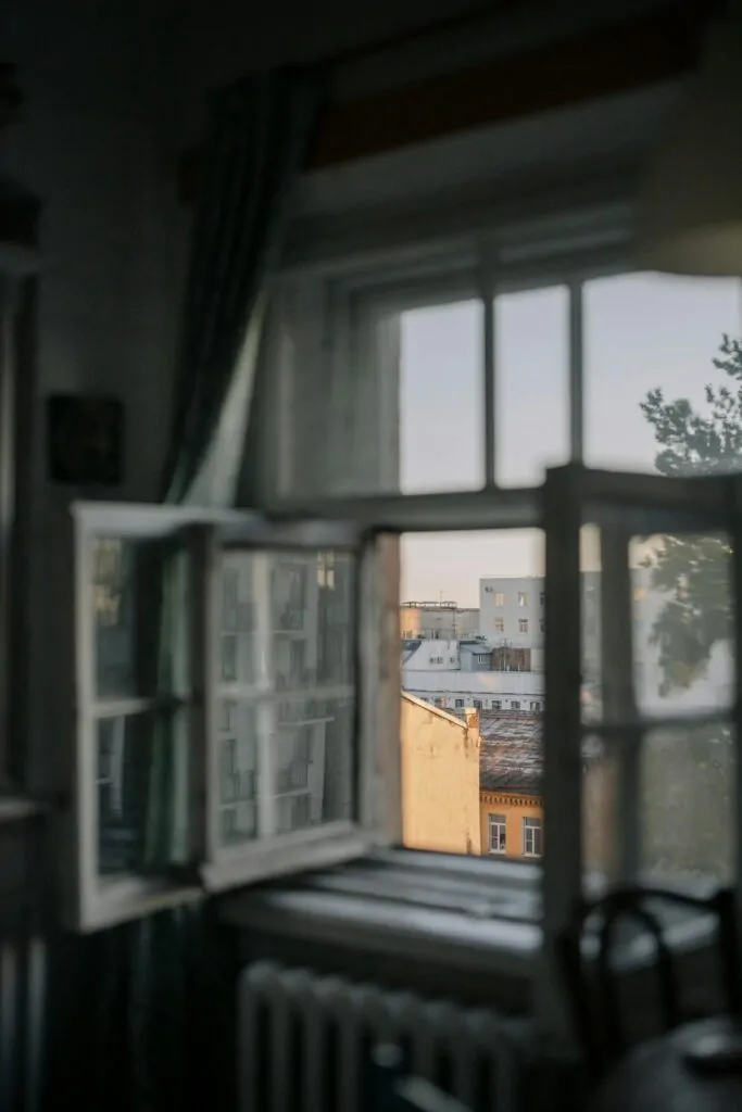 The Inspiration Behind Psychosynthesis: Roberto Assagioli’s Vision Alex Golding Therapy A dim, sparsely furnished room with daylight coming in through a tall window.