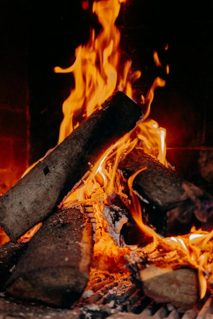 From Crisis to Calling: Psychosynthesis Therapy for Meaningful Life Transitions Alex Golding Therapy Flames rising from burning logs in an open fire.